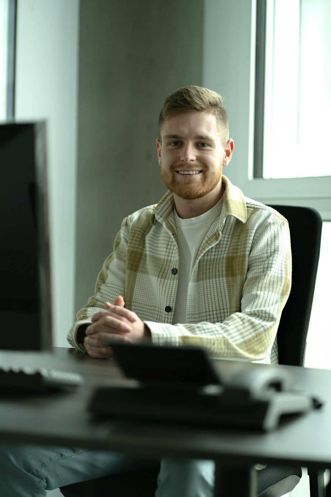 Portrait of a Slovenian male programming instructor in his 40s smiling